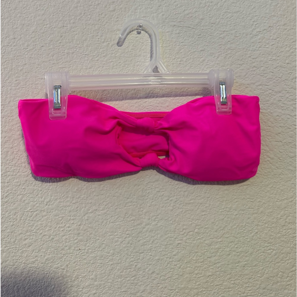 Brand new shown swim top. Size medium